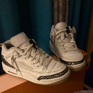 Jordan White Low Top Sneakers with Black and Gold Trim